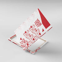 Red-and-white canvas wall art with “YOUR TEXT” and lion-heart pattern, angled view.