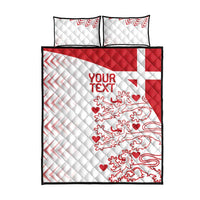 White quilt bed set with two pillows, red crest, and zigzag trim; black edges