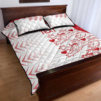 White and red quilt bed set with quilt stitching, crest, and hearts pattern