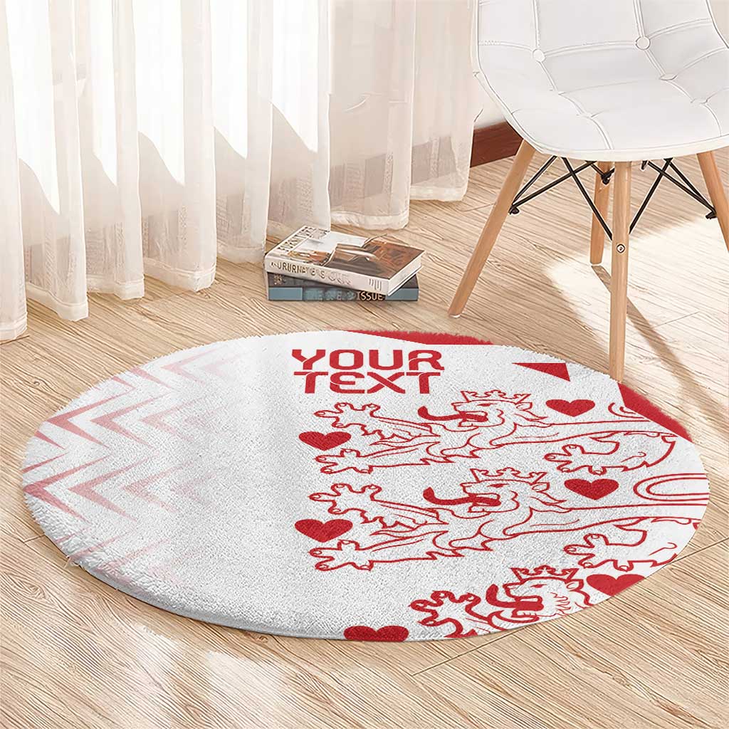 Round carpet on floor, light gray with red 'YOUR TEXT' and animal-and-heart pattern