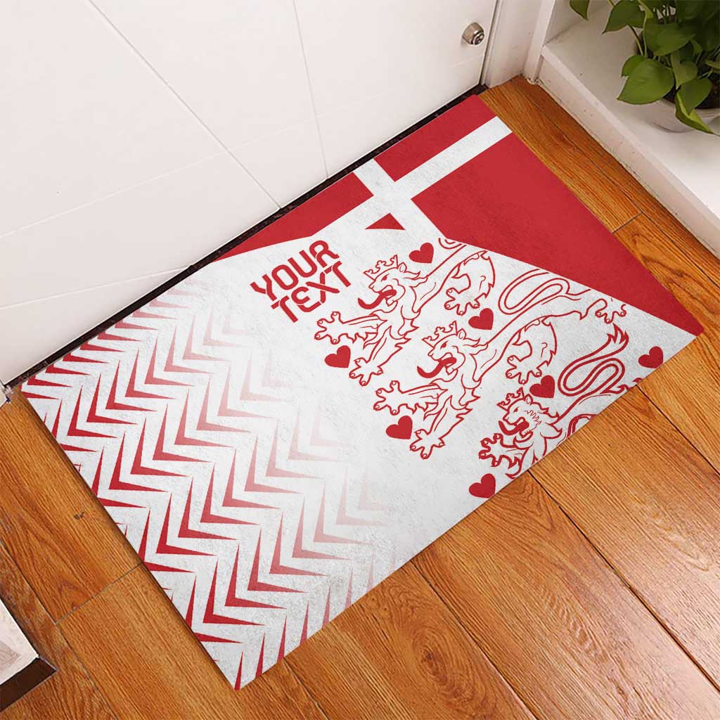 Denmark-style rubber doormat in red and white with 'YOUR TEXT' and lion-heart design.
