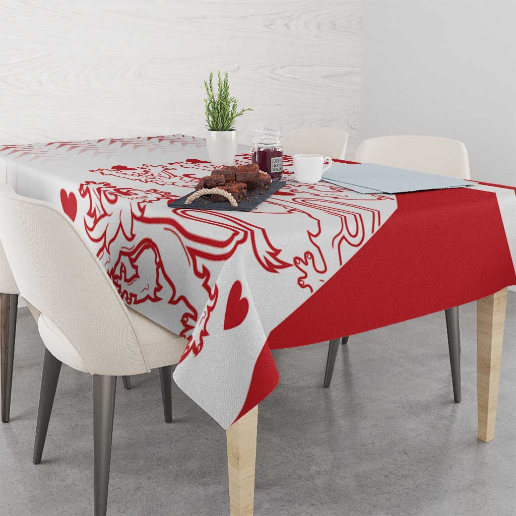 Red and white graphic tablecloth with diagonal panel and crest-like motifs