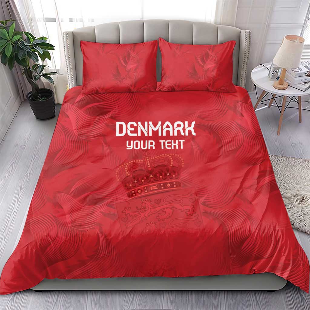 Red bedding set with duvet and two pillow shams, Denmark text and crown artwork