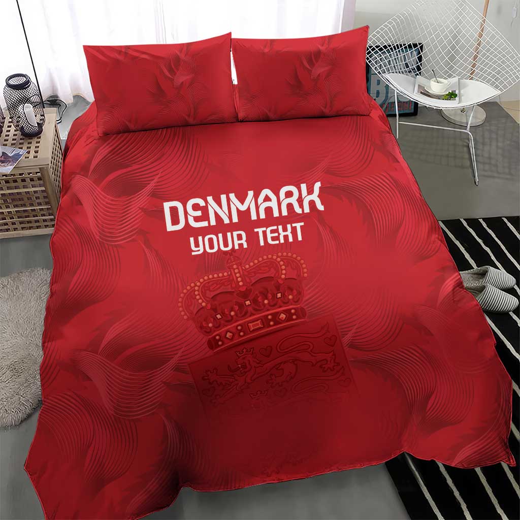 Red bedding set with duvet and two pillow shams, Denmark text and crown graphic