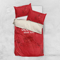 Red bedding set with duvet and two pillow shams, Denmark text and crown graphic