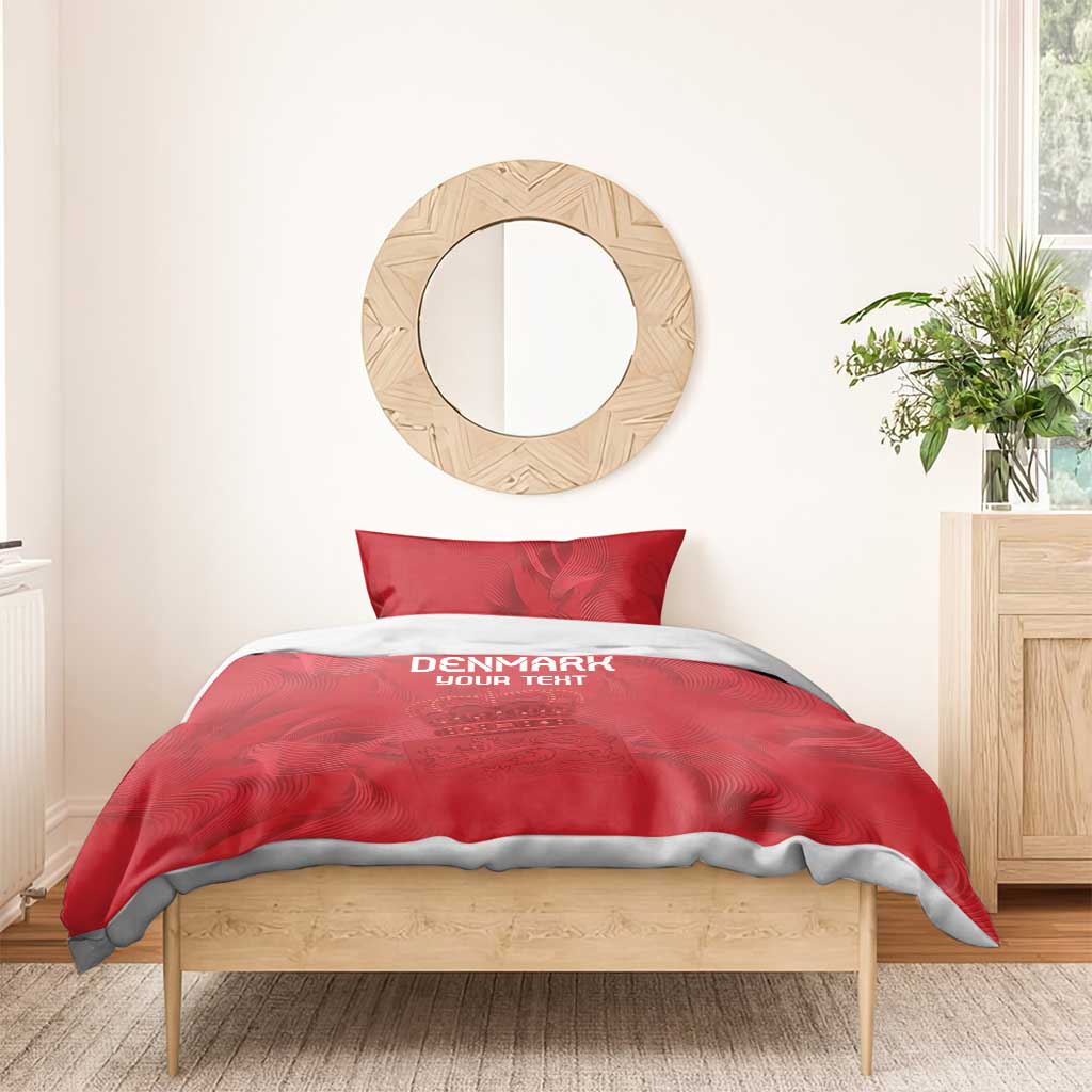 Red bedding set with duvet and two pillow shams, Denmark text and crown emblem