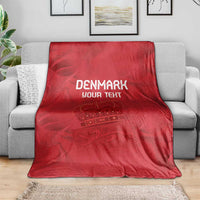 Red football blanket on grey couch with white DENMARK YOUR TEXT and embroidered-style crest graphic