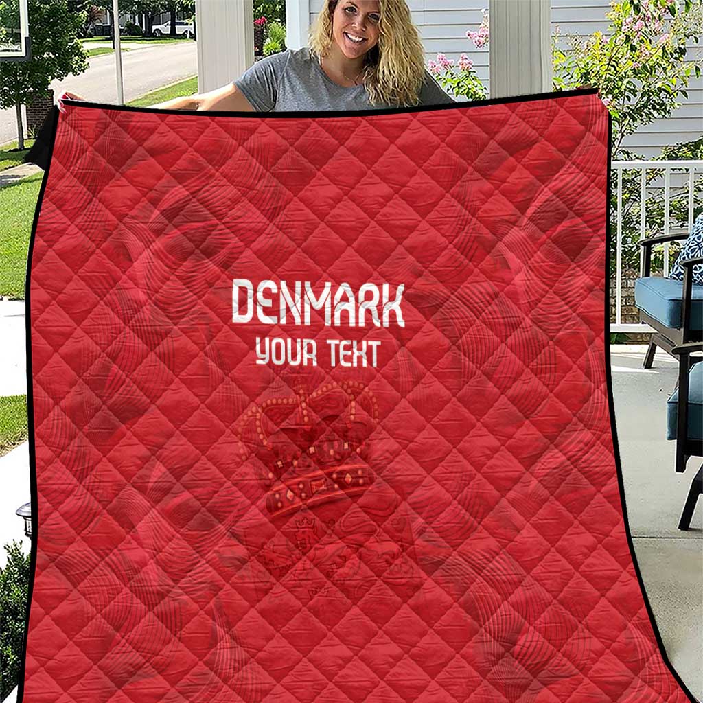 Red quilt with diamond quilting, black edge trim, printed 'DENMARK' and 'YOUR TEXT'