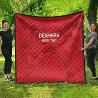 Red quilt spread outdoors, diamond quilting with 'DENMARK' and 'YOUR TEXT' centered