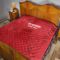 Red quilt on a bed, diamond quilting pattern, black border, 'DENMARK' and 'YOUR TEXT' print