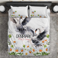 White bedding set with centered gray swan scene and orange daisy floral accents