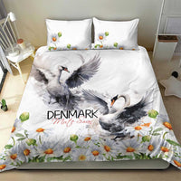 White duvet and pillowcases featuring gray swan artwork with orange daisies border