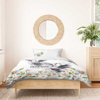 White swan-themed duvet with orange daisies over bed with matching pillowcase set