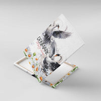 Canvas wall art with rotated view of gray mute swans, Denmark text, and daisy blooms