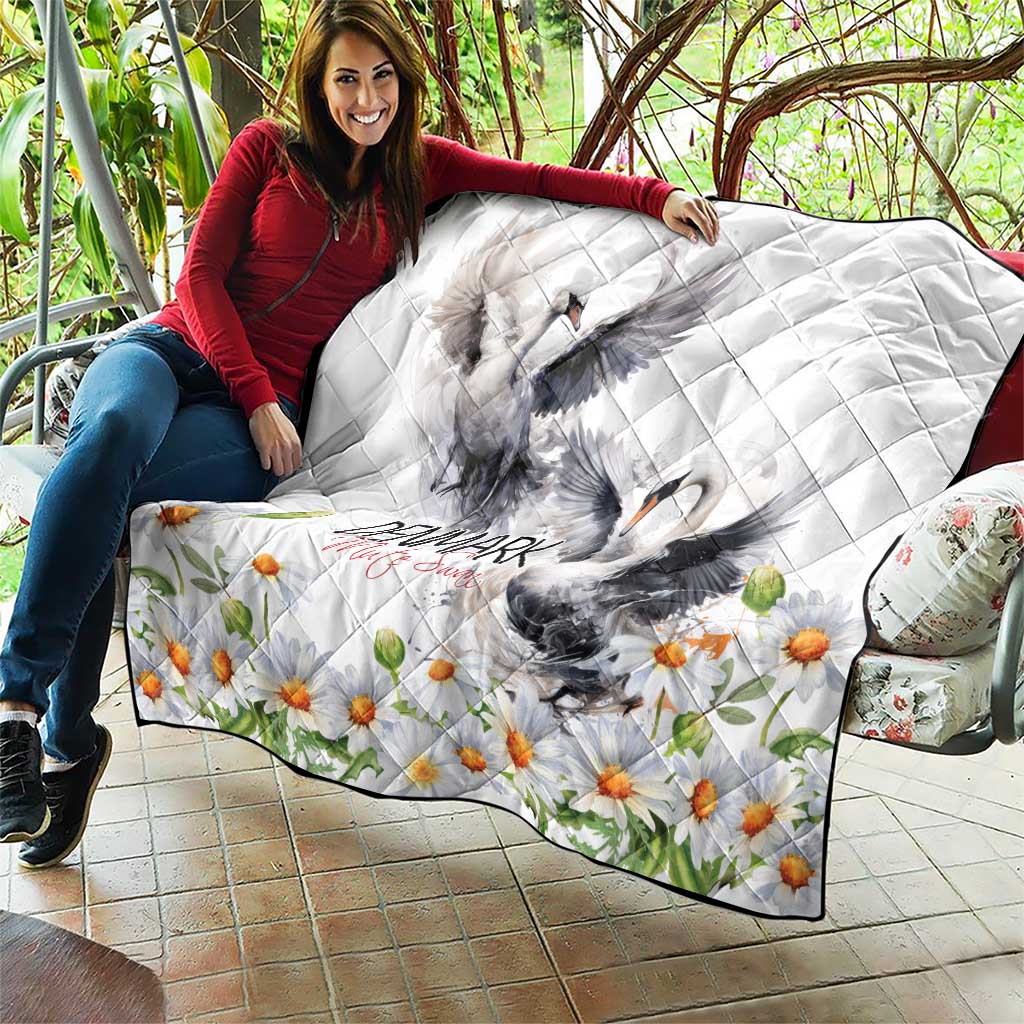 White quilt with gray mute swan design, chamomile daisy flowers, and Denmark text; quilted
