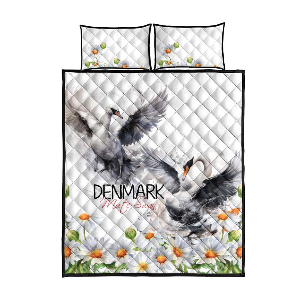 White quilt and two pillows with mute swan center art, chamomile daisies, and black edge