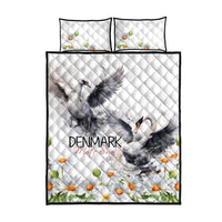 White quilt and two pillows with mute swan center art, chamomile daisies, and black edge