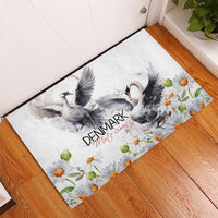 Mute swan rubber doormat with two swans and chamomile daisy pattern, Denmark Mute Swan text