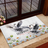 Mute swan rubber doormat showing two gray swans and chamomile daisy flowers on white