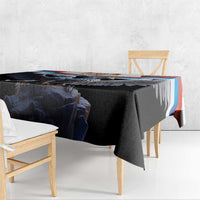 Black tablecloth with eagle-crest border detail, corner drape on table