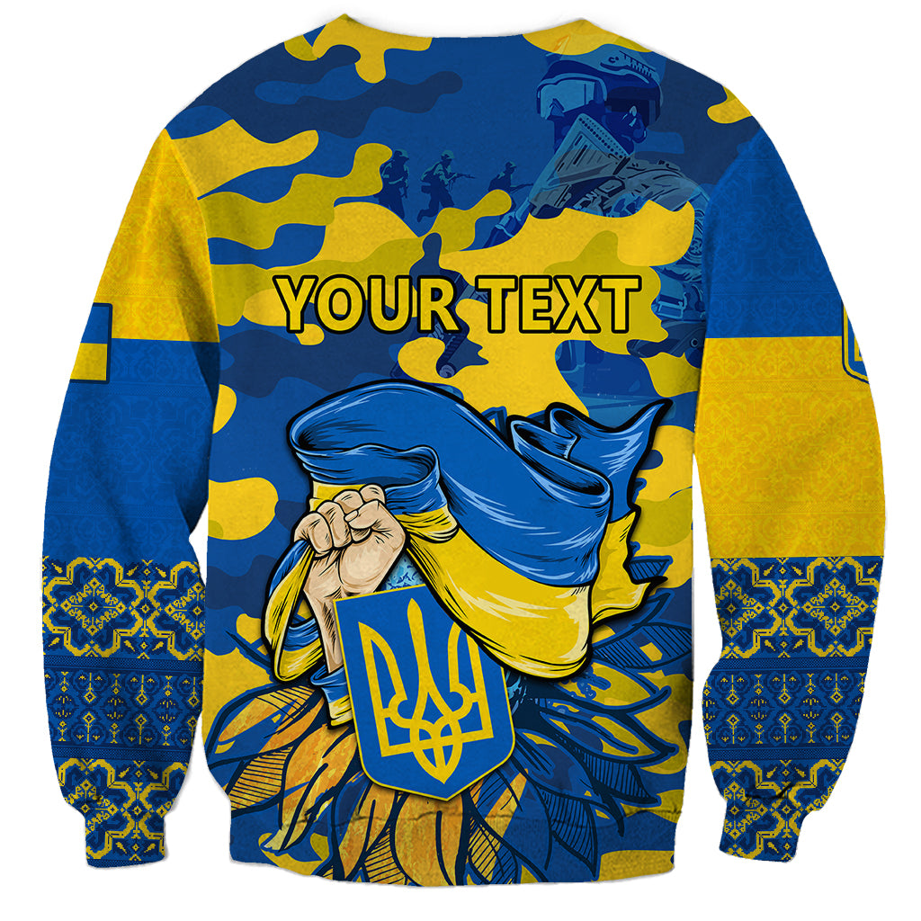 Blue and yellow unisex sweatshirt with camo graphic, trident emblem, and 'YOUR TEXT'