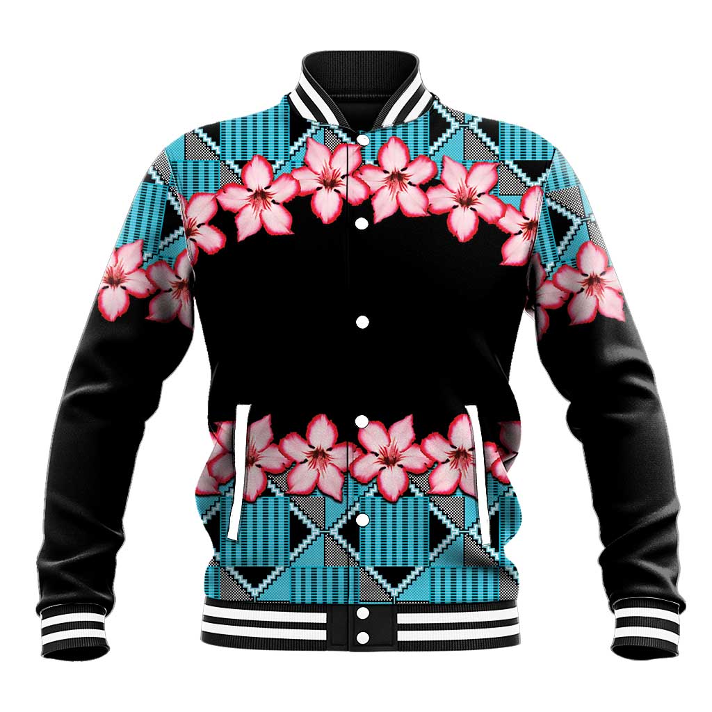 Blue baseball jacket with pink flower print, black front, kente-style geometric yoke