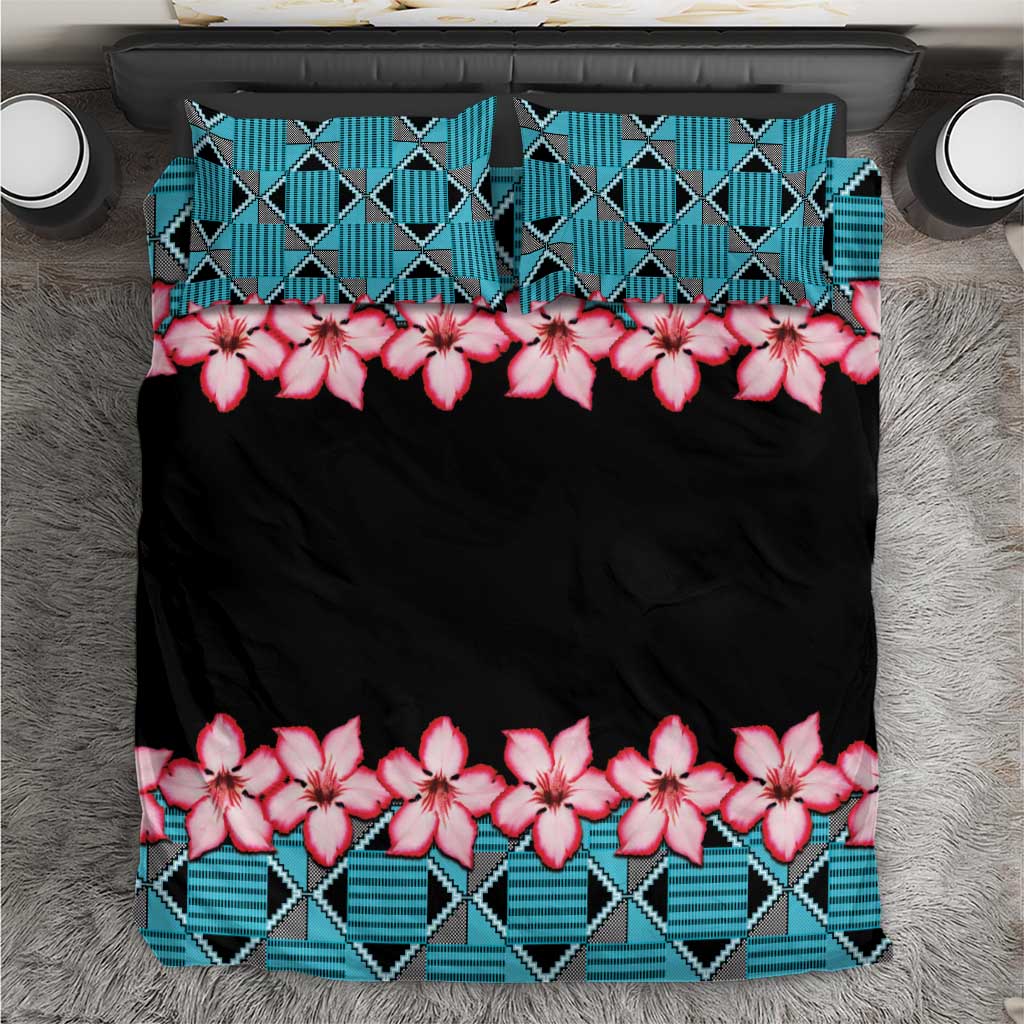 Black bedding set with turquoise geometric Kente pattern and pink hibiscus flowers