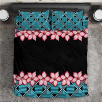 Black bedding set with turquoise geometric Kente pattern and pink hibiscus flowers