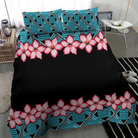 Black duvet top with pink hibiscus garland and turquoise geometric stripe hem