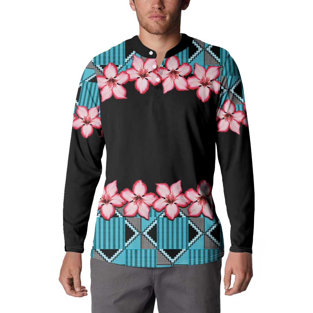 Mens button sweatshirt worn on model: black with pink flowers and blue geometric trim