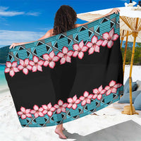 Blue geometric and floral sarong with pink blossoms and black wrap fabric