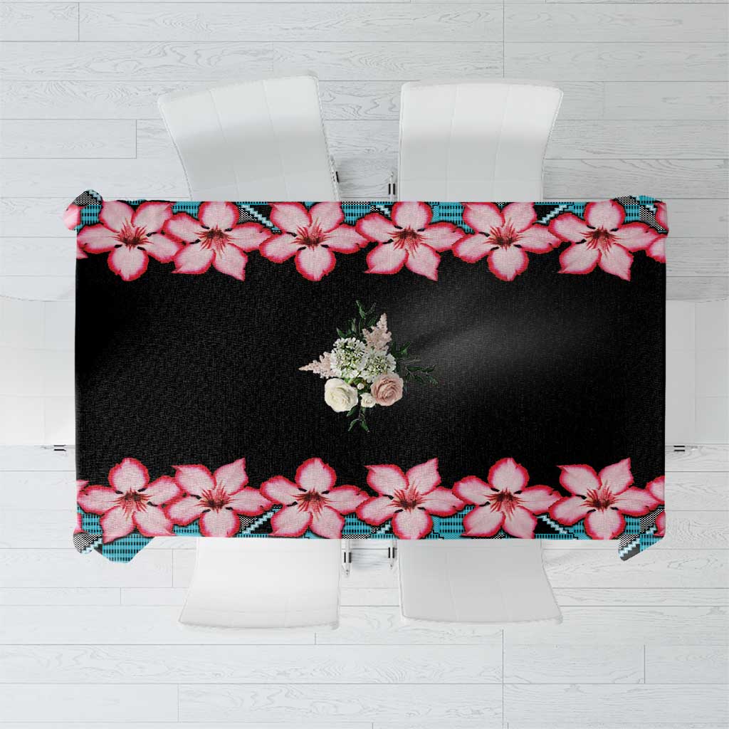 Rectangular black tablecloth with red hibiscus flowers and blue geometric border