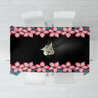 Rectangular black tablecloth with red hibiscus flowers and blue geometric border
