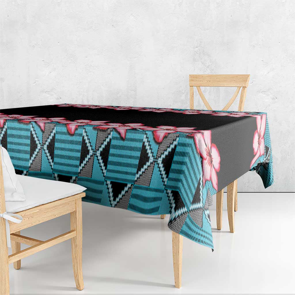 Rectangular tablecloth draped over table edge, black background with red hibiscus and blue