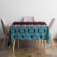Rectangular tablecloth with black base, red hibiscus blooms, and blue zigzag band