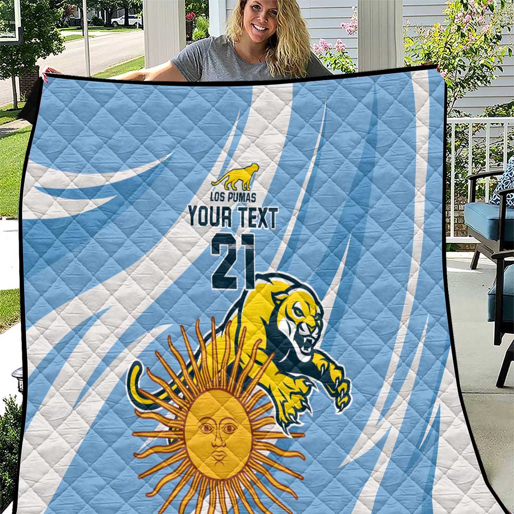 Light blue and white Los Pumas quilt close-up with sun, lion, “YOUR TEXT” and 21