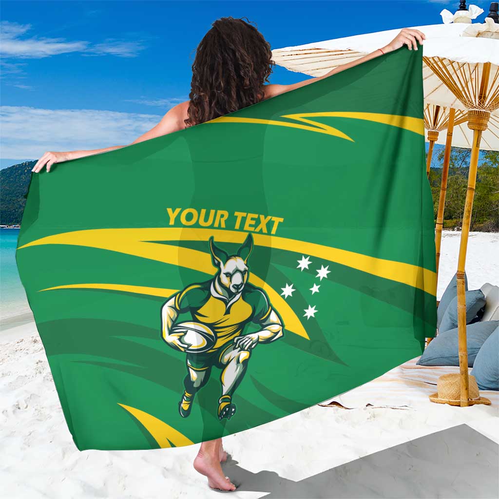 Green sarong spread wide showing Wallabies mascot and gold rays with personalized text