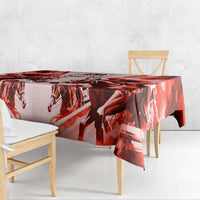 Red and white horse motif tablecloth with overhanging corner on table