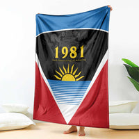 Flag blanket draped: blue top band, black center, red bottom, white triangle, 1981 sun