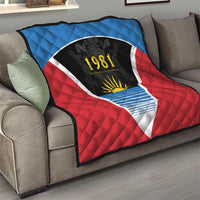 Antigua and Barbuda 1981 quilt draped on sofa, red and blue flag triangle with yellow sun