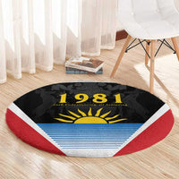 Round carpet rug with red border and black '1981' design, yellow sun and blue stripe band