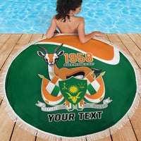 Personalized round beach blanket with green 1958 Niger Republic Day logo and fringe edge