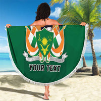 Personalized round beach blanket held up, featuring green Niger Republic Day graphic and fringe