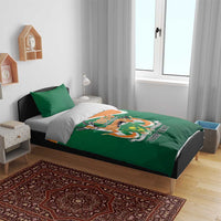 Green and orange bedding set with matching pillow covers and 1958 emblem on duvet