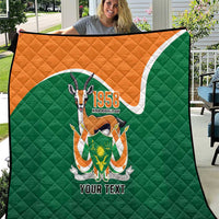 Green quilted throw quilt with orange top, 1958 emblem and 'YOUR TEXT' front