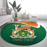 Personalized round green carpet with orange stripe, 1958 emblem, and YOUR TEXT