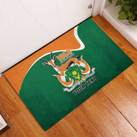 Green rubber doormat with crest and orange trim, centered 'YOUR TEXT' personalization