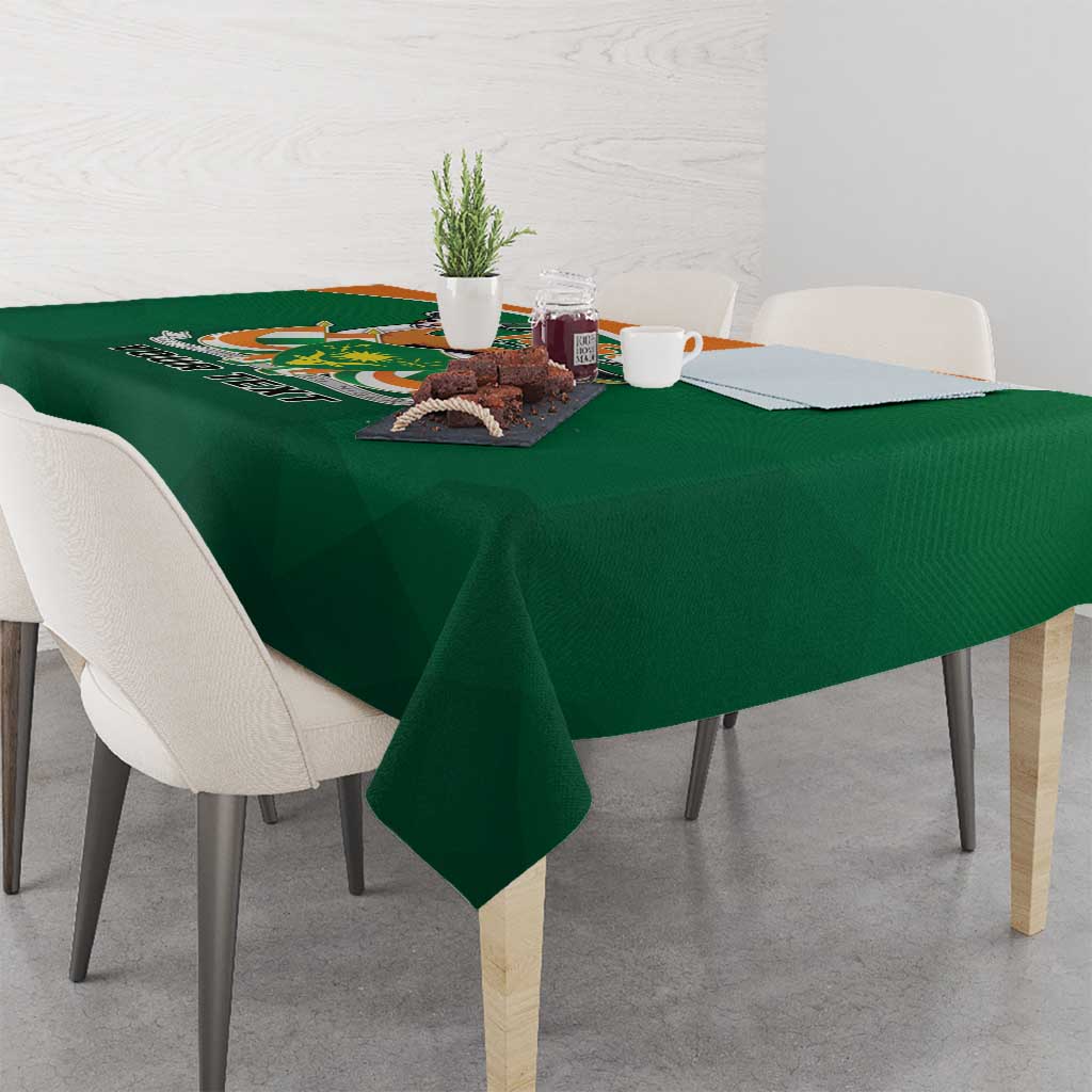 Green personalized tablecloth with “1958” crest and “YOUR TEXT” across tabletop