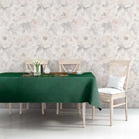 Green personalized tablecloth with crest and “YOUR TEXT” print on dining setup