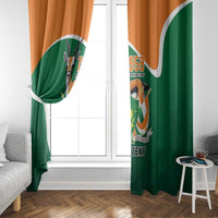 Green and orange window curtain panels with crest emblem and 'YOUR TEXT' printing